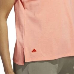Adidas 2023 Women's Go-To Heathered Polo 10 Adidas 2023 Women's Go-To Heathered Polo -Callaway Golf Shop adidas 23 womens go to heathered polo coral fusion detail2 itempicture